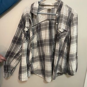 Long sleeved plaid shirt.